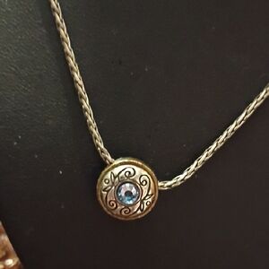 Elegant Gold and Silver Necklace with Blue Gem